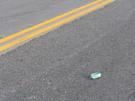 dew can in road