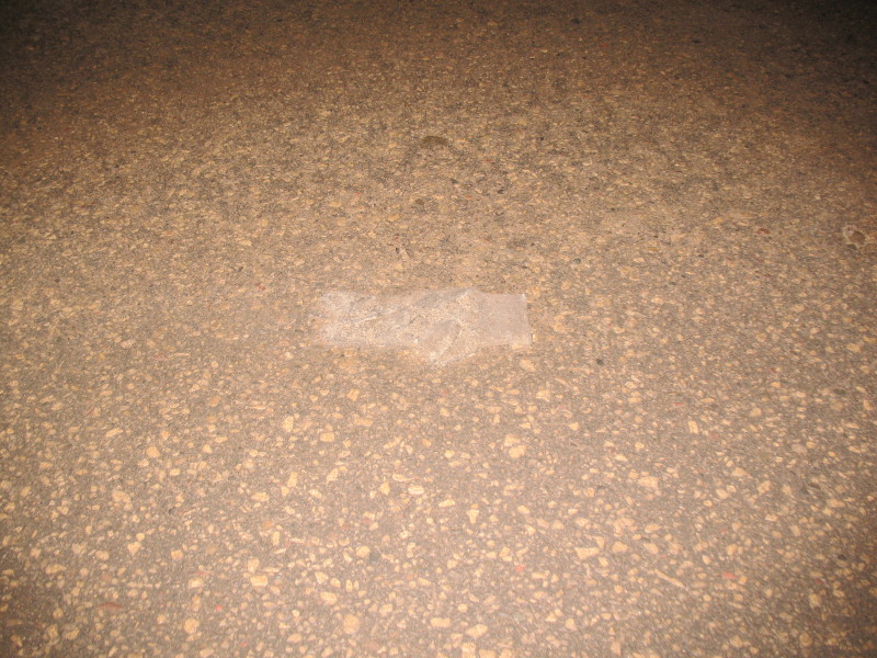 glove under ice in road