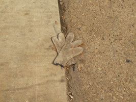 gray gloves in road