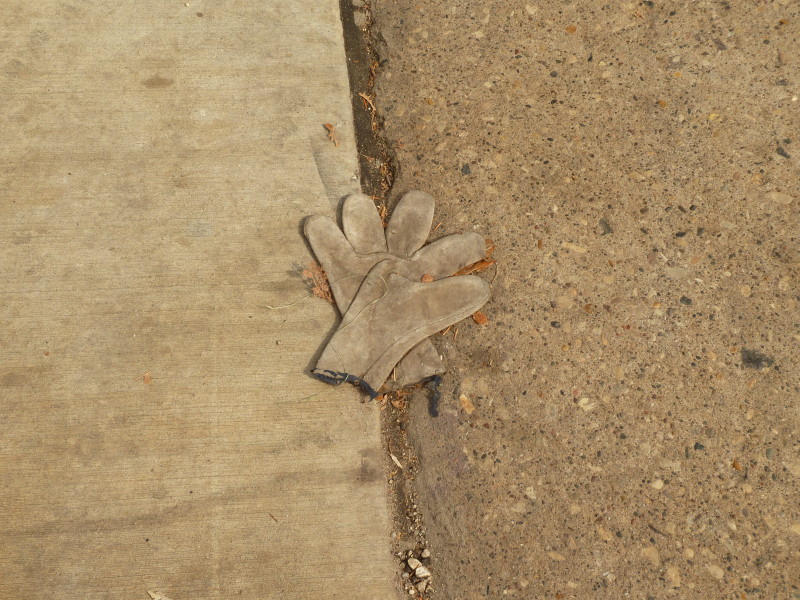 gray gloves in road