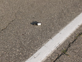 small bottle in road