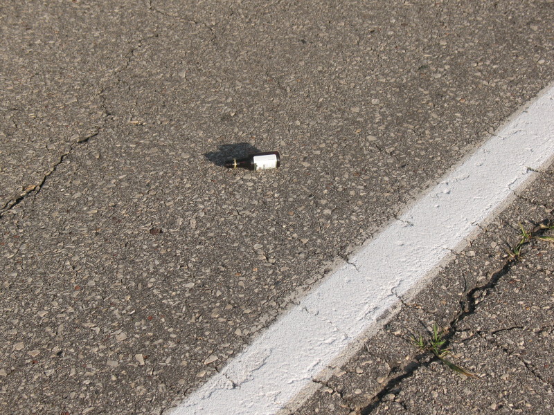 small bottle in road