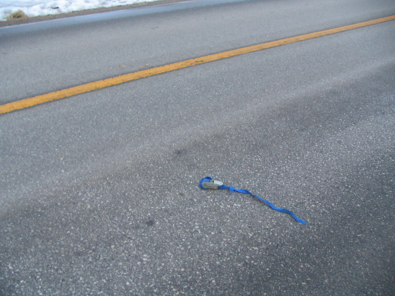 blue strap in road