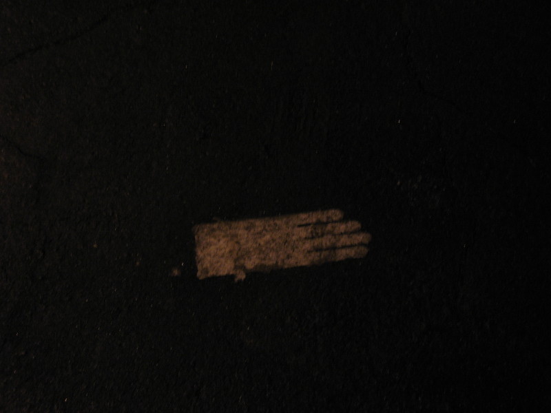 dress glove on dark road