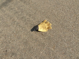 yellow glove in road