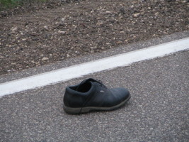 black shoe in road